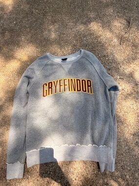Warner Bros. Grey Crewneck with Maroon and Gold Gryffindor Lettering